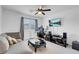 This living room features a contemporary style with couch and entertainment area at 7260 Grace Estate Ave, Las Vegas, NV 89113