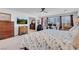 Bright main bedroom featuring a work space, ceiling fan, and neutral decor at 7260 Grace Estate Ave, Las Vegas, NV 89113