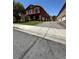 Charming two-story townhome with lush green lawn and attached garages at 805 Desert Oak Ct, Las Vegas, NV 89147