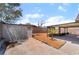 Backyard showcasing a storage building, carport, desert landscaping and concrete at 806 Fireweed Dr, Henderson, NV 89002