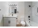 Chic bathroom with a combination tub/shower, modern vanity, updated hardware, and sleek tile at 806 Fireweed Dr, Henderson, NV 89002