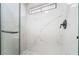 Luxurious shower featuring marble-style tile, a glass door, and sleek black fixtures, offering a spa-like experience at 806 Fireweed Dr, Henderson, NV 89002