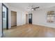 Bright bedroom featuring hardwood floors, a ceiling fan, and double closets at 806 Fireweed Dr, Henderson, NV 89002