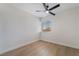 Bright bedroom with a ceiling fan, light-colored walls, wood-look flooring, and natural light from the window at 806 Fireweed Dr, Henderson, NV 89002