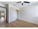 Inviting bedroom features wood-look floors, a ceiling fan, closet, and ample natural light at 806 Fireweed Dr, Henderson, NV 89002