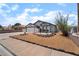 Charming single-story home with a two-car garage and desert landscaping in the front yard at 806 Fireweed Dr, Henderson, NV 89002