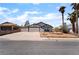 Charming single-story home with a two-car garage and a landscaped front yard with desert landscaping at 806 Fireweed Dr, Henderson, NV 89002