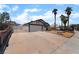 Single-Gathering home boasting a spacious driveway, secure gate, and desert-friendly landscaping at 806 Fireweed Dr, Henderson, NV 89002