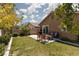 Well-maintained backyard with a grassy lawn, patio area, and outdoor seating, perfect for relaxation at 820 Bernini St, Las Vegas, NV 89144