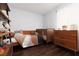 Cozy bedroom with wooden furniture and a large window allowing natural light at 820 Bernini St, Las Vegas, NV 89144