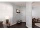 Bright foyer featuring wood floors, white trim, and neutral walls leading to the dining and living areas at 820 Bernini St, Las Vegas, NV 89144