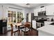 Eat-in kitchen with modern appliances, dark wood floors and sliding glass doors that let in natural light at 820 Bernini St, Las Vegas, NV 89144