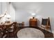 Well-lit office space with hardwood floors, classic furniture, and a decorative rug, ideal for productivity at 820 Bernini St, Las Vegas, NV 89144