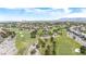 Breathtaking aerial perspective of a golf course, showcasing community living and manicured green spaces at 8800 Cortile Dr, Las Vegas, NV 89134