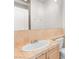 Bathroom features a drop-in sink, vanity, and a sleek frameless mirror at 8800 Cortile Dr, Las Vegas, NV 89134
