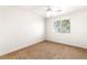 Cozy bedroom with carpet flooring and a large window offering natural light and views at 8800 Cortile Dr, Las Vegas, NV 89134
