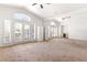 Bonus room with neutral carpeting, large windows, and mirrored wall at 8800 Cortile Dr, Las Vegas, NV 89134