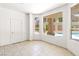 Bright bonus room with tile flooring and a view of the outdoor pool and spiral staircase at 8800 Cortile Dr, Las Vegas, NV 89134