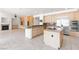 Open kitchen with granite countertops, stainless steel appliances, and a central island at 8800 Cortile Dr, Las Vegas, NV 89134