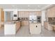 Spacious kitchen with stainless steel appliances, granite countertops and light wood cabinetry at 8800 Cortile Dr, Las Vegas, NV 89134