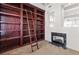 Rolling ladder stands in front of a full wall of built-in bookshelves in a private library at 8800 Cortile Dr, Las Vegas, NV 89134
