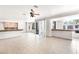 Open concept living space with tile floors, leading to the kitchen and outdoor patio at 8800 Cortile Dr, Las Vegas, NV 89134