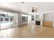 Spacious living room with fireplace, access to the pool area, and tile flooring at 8800 Cortile Dr, Las Vegas, NV 89134