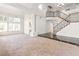 Open living room featuring a wrought-iron staircase and elegant architectural details at 8800 Cortile Dr, Las Vegas, NV 89134
