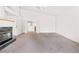 Spacious living room with a fireplace and open doorway to other rooms at 8800 Cortile Dr, Las Vegas, NV 89134