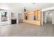 Open living room with fireplace, built-in shelving, tile flooring and ample space for entertaining at 8800 Cortile Dr, Las Vegas, NV 89134
