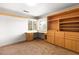 Bright office space with natural light, built in desk, and spacious shelving units at 8800 Cortile Dr, Las Vegas, NV 89134