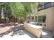 The backyard outdoor kitchen features a grill and ample counter space, perfect for outdoor entertaining and dining al fresco at 8800 Cortile Dr, Las Vegas, NV 89134