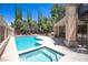 Backyard featuring a swimming pool and hot tub with spa, and plenty of patio space at 8800 Cortile Dr, Las Vegas, NV 89134