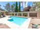 Inviting in-ground pool surrounded by decorative walls offering privacy and charm at 8800 Cortile Dr, Las Vegas, NV 89134
