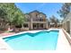 Backyard featuring a sparkling in-ground pool and patio area, perfect for entertaining at 8800 Cortile Dr, Las Vegas, NV 89134