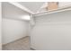 Spacious walk-in closet with shelving, rod for hanging clothes, and tiled floor at 8800 Cortile Dr, Las Vegas, NV 89134