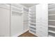 Spacious walk-in closet with custom shelving and ample storage space at 8800 Cortile Dr, Las Vegas, NV 89134
