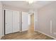 Bedroom featuring wood-look floors, star decals on the ceiling and a double door closet at 9053 Entrancing Ave, Las Vegas, NV 89149