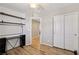 Bedroom featuring built-in shelves, wood-look floors and a double door closet at 9053 Entrancing Ave, Las Vegas, NV 89149