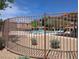 Community pool is surrounded by secure fencing at 9053 Entrancing Ave, Las Vegas, NV 89149