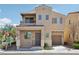Charming two-story home boasts neutral stucco exterior and covered porch entry at 9053 Entrancing Ave, Las Vegas, NV 89149
