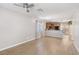 Open-concept living room with wood flooring flows into the adjacent kitchen at 9053 Entrancing Ave, Las Vegas, NV 89149