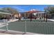 Modern community playground featuring swings and various play structures, perfect for recreation at 9053 Entrancing Ave, Las Vegas, NV 89149