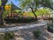 Community playground nestled among trees and landscaping, providing a shaded and inviting recreation space at 9053 Entrancing Ave, Las Vegas, NV 89149