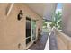Charming side yard with a covered patio and elegant lighting fixtures at 9053 Entrancing Ave, Las Vegas, NV 89149