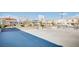 Community basketball court and playground featuring a basketball hoop and structures, providing a safe and fun experience at 9140 Entrancing Ave, Las Vegas, NV 89149