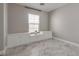 Bedroom with bright grey paint, stone floors, and built-in shelves at 9140 Entrancing Ave, Las Vegas, NV 89149