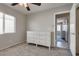 Bedroom with white dresser, carpet flooring, and natural light at 9140 Entrancing Ave, Las Vegas, NV 89149