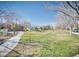 Well-maintained greenbelt common area with a sidewalk for residents to enjoy outdoor activities at 9140 Entrancing Ave, Las Vegas, NV 89149