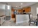 A well-lit kitchen featuring wooden cabinets and stainless steel appliances at 9140 Entrancing Ave, Las Vegas, NV 89149